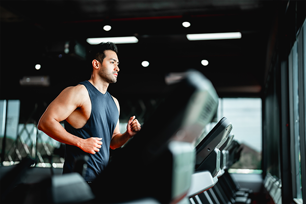 Male in the gym on a treadmill