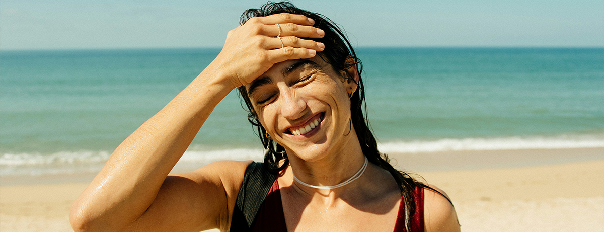 Female on beach with happy expression
