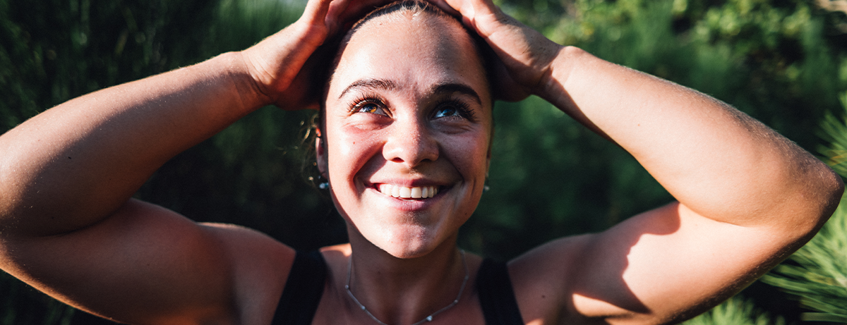 Female outdoors with happy expression
