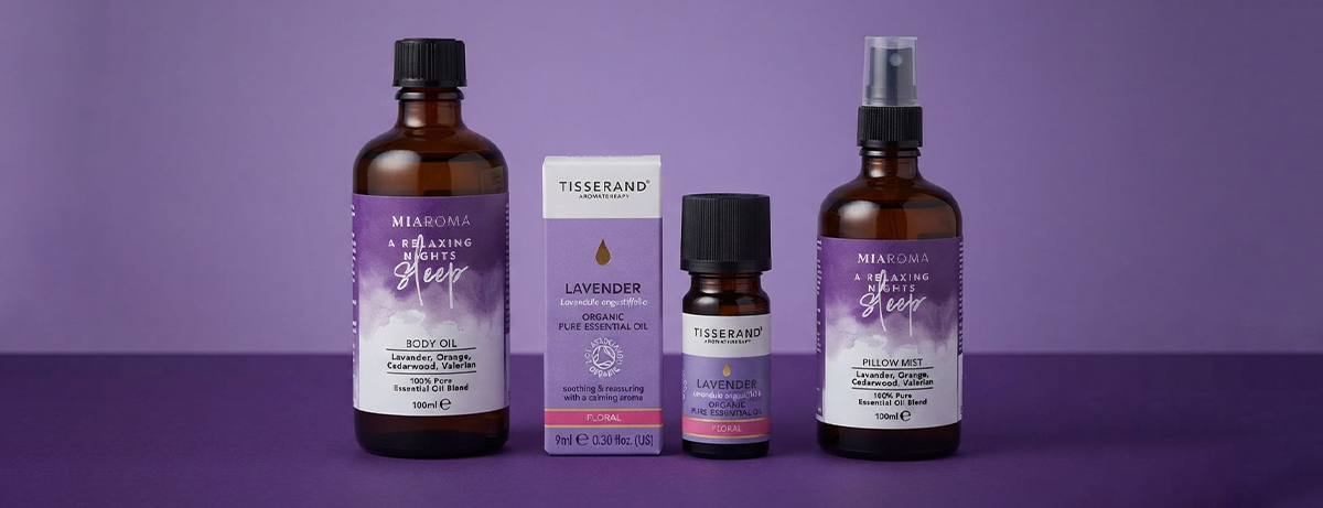 Selection of massage oil products on a purple backround