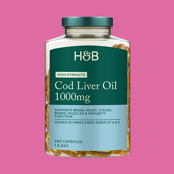 Jar of supplements on coloured background