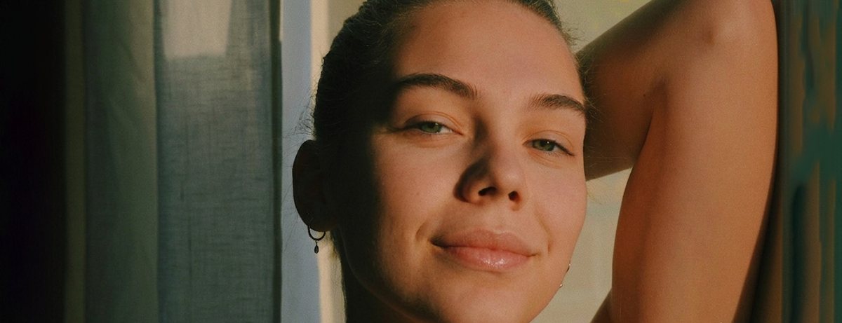 Female standing up close up with smiling expression