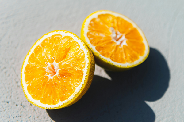 Orange slices on a grey background