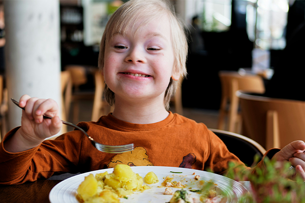 kid eating in a restuarant