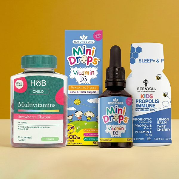 Selection of kids multivitamins on a yellow background