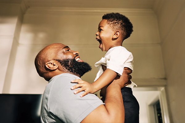 father holding son