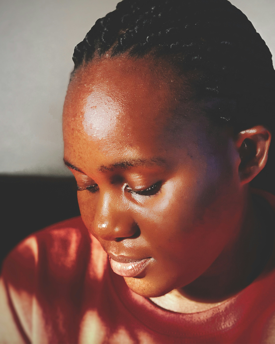 Female with sunlight on face looking down