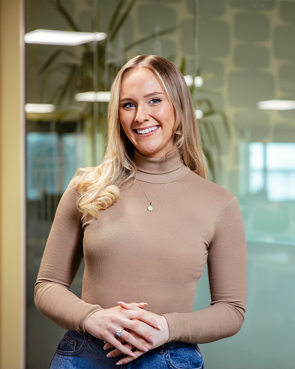 Female colleague standing in office location