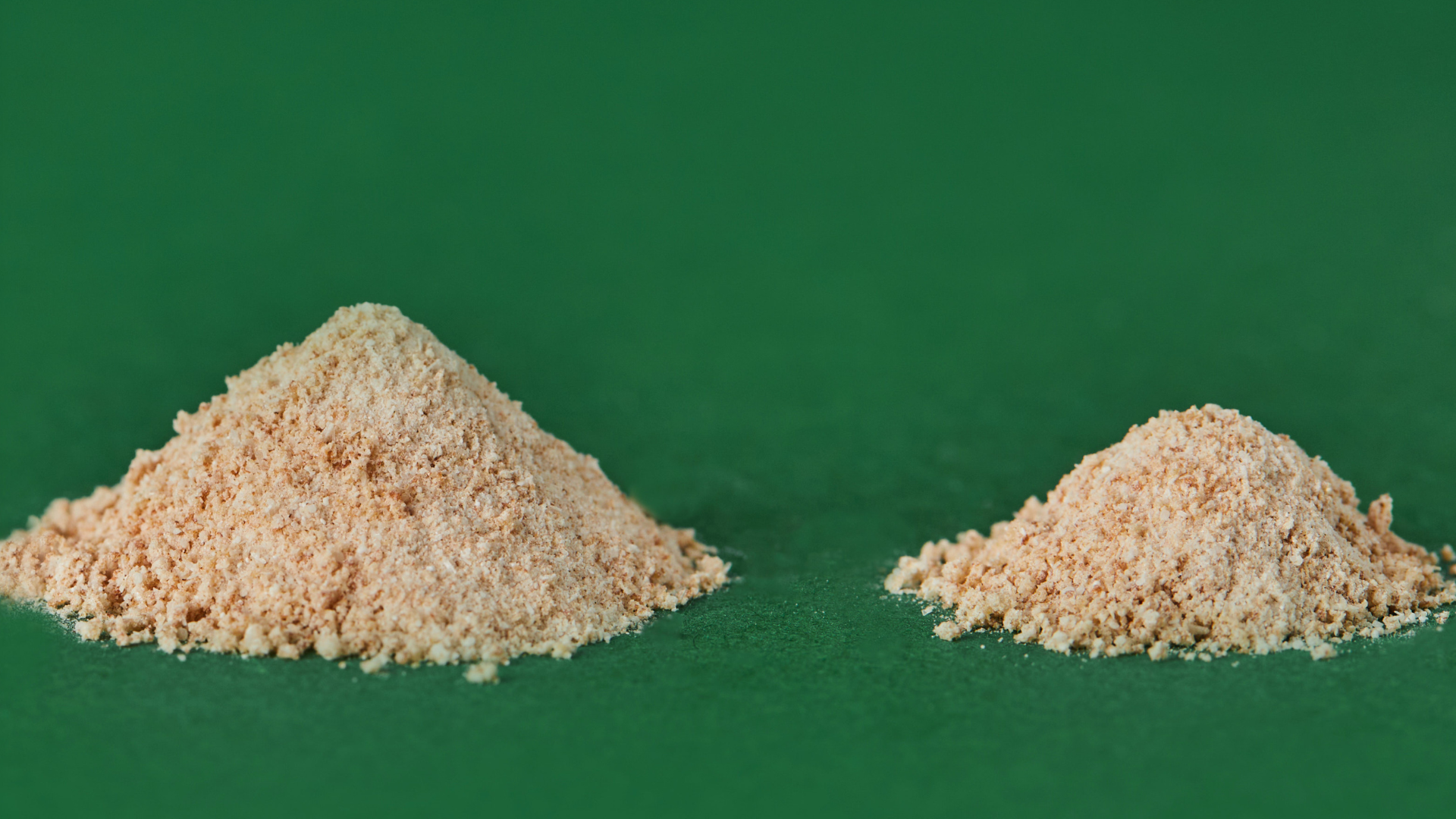 Two piles of beige powder
