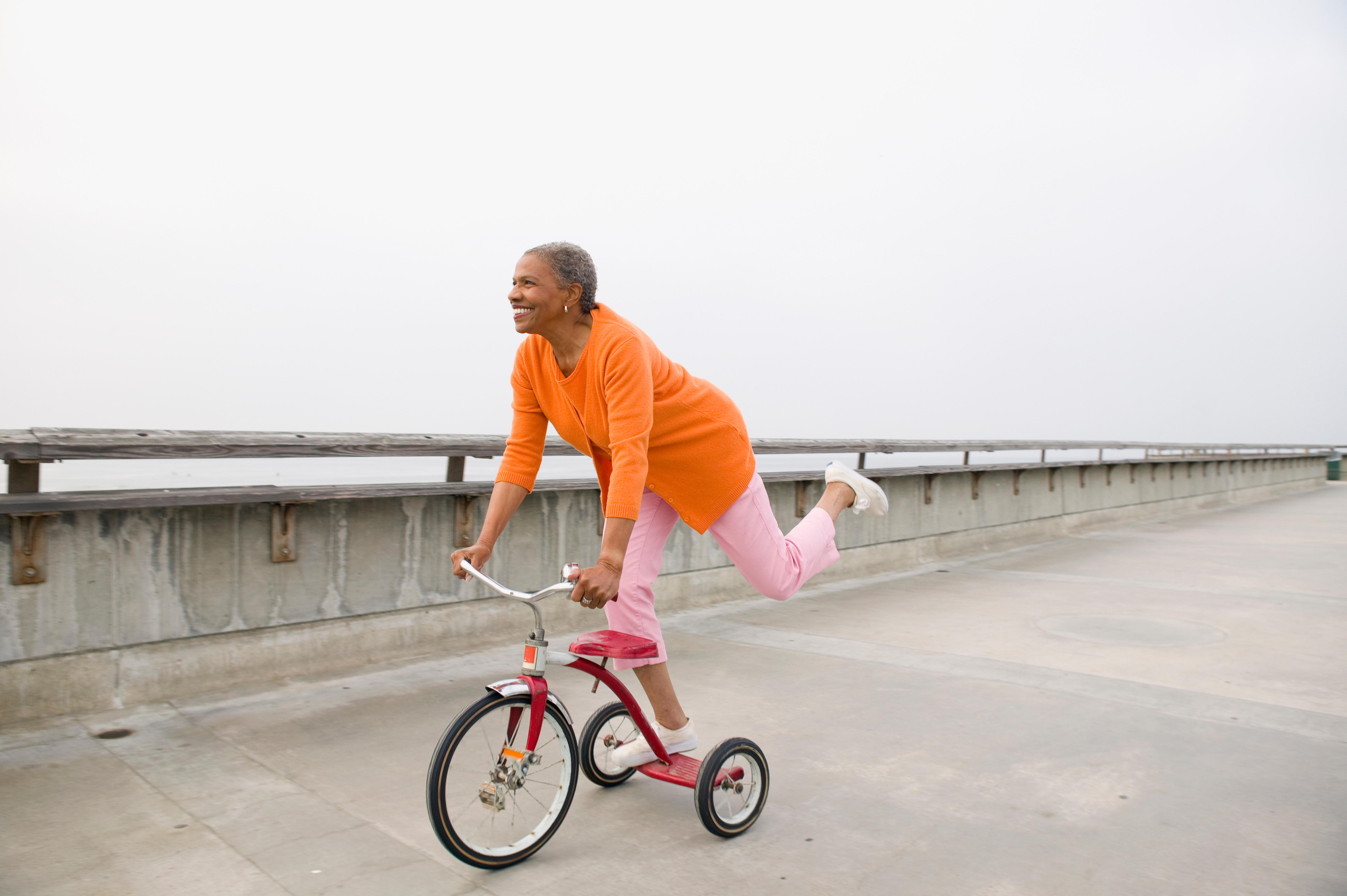 Middle-aged woman riding a tricycle